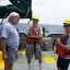 Brian Wells (in middle) pausing while sediment cores are traveling to the seafloor with George Guthro and Teresa Greely